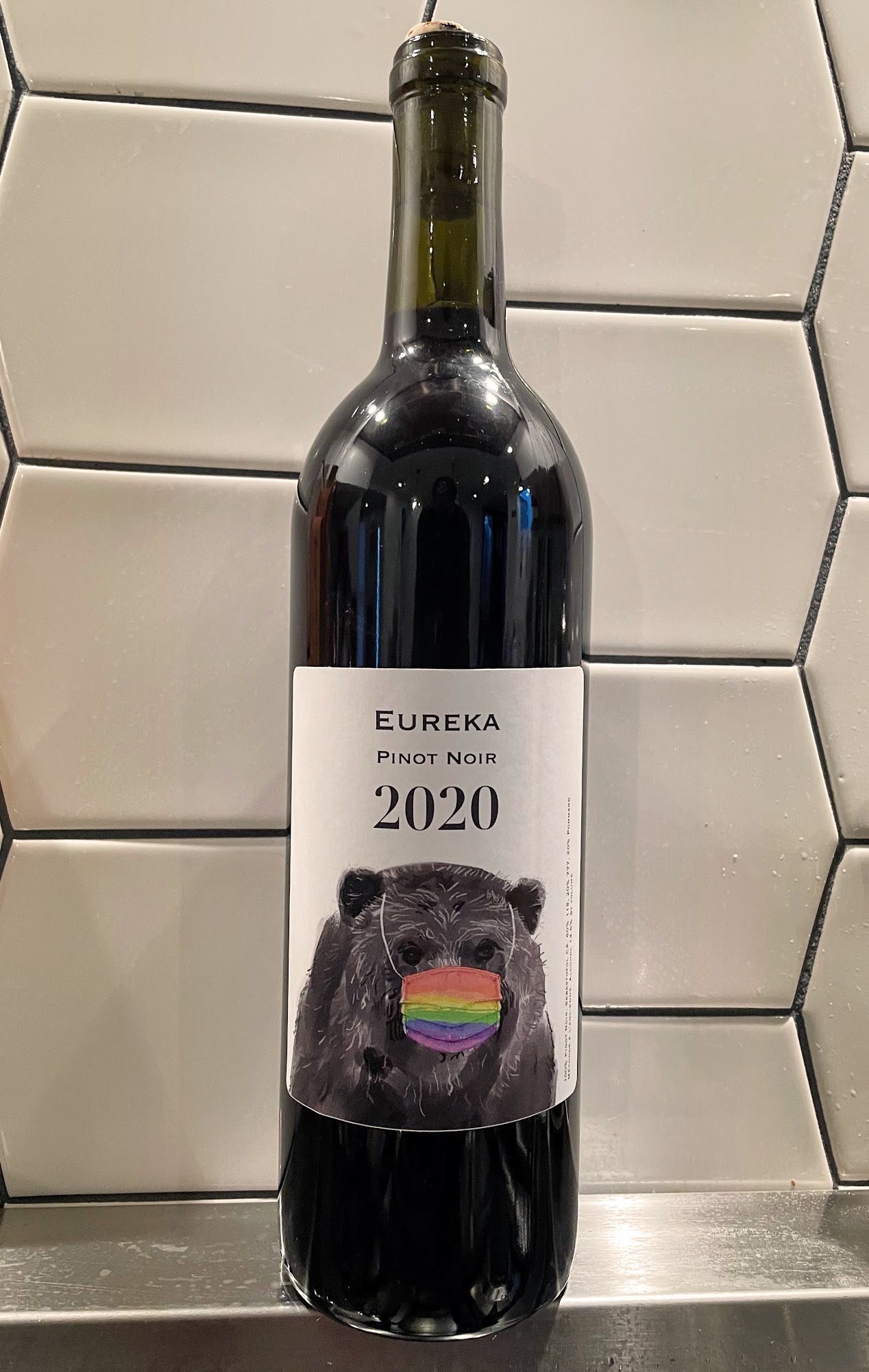 2020 Pinot bottle with label.